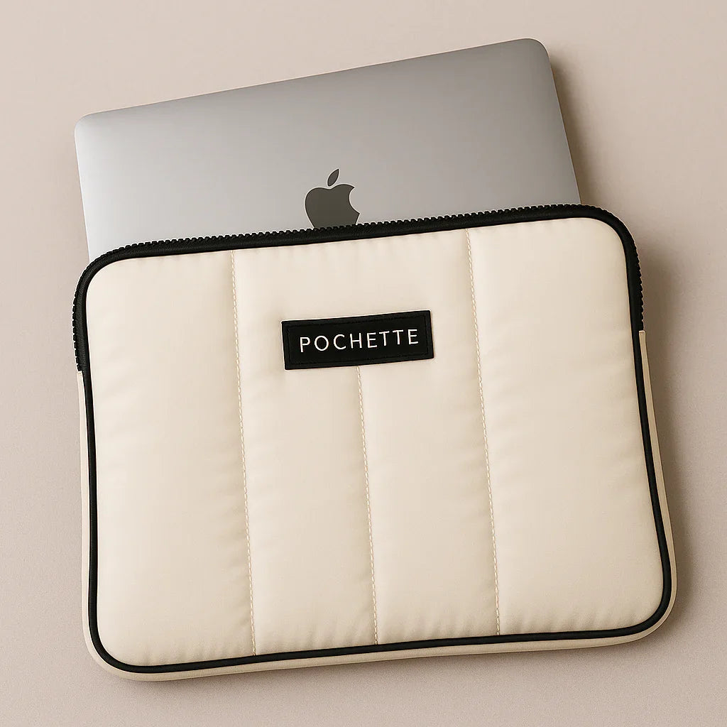 Quilted padded laptop sleeve in cream with black trim and zipper, custom fit case