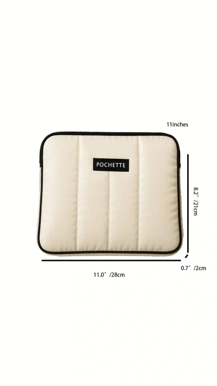 Quilted cream padded laptop sleeve with zipper, black trim, and size dimensions shown